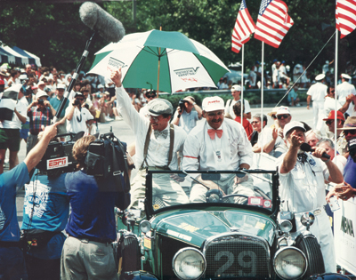 photo 5: howard sharp driving his 1929 dodge sport roadster (one of only 1,200 made) as he crosses the finish line in the 1993 great race. he is now $30,000 richer and soon to be a star on espn sports! 