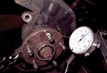 do not use a wire wheel. this could damage the surface. some flanges and lug studs have anti-corrosion surface treatments that can be damaged by over aggressive abrasives.