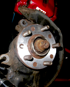 On some flanges, measuring runout is difficult due to a very small area that the needle of the dial indicator can ride on. Most manufacturers recommend taking the reading as far out from the center of the hub as possible. As a general rule, there should be less than .002” or below the manufacturer’s specification of lateral runout.