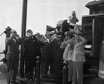in a 1940s era issue of life magazine, city officials and military brass  prepare for a test of the early-warning chrysler-bell victory siren.