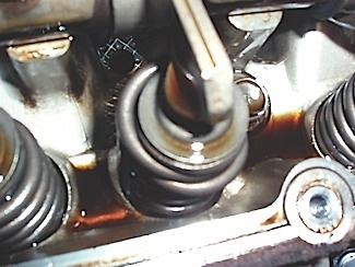 a broken exhaust valve spring proved to be the root cause of the rough idle condition on the 3.8l chrysler van.