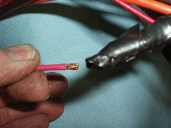 photo 3: a slight tug separated the wire from the butt  connector. could this poorly crimped splice cause the loss  of b+ voltage to fuse ecm #1?