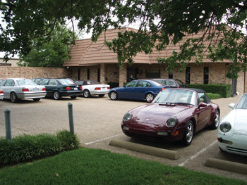 a well-manicured entrance is part of louden’s marketing plan, along with a building that does not look like an auto repair shop. many first-time customers will drive by, not realizing the facility is actually an auto repair business.