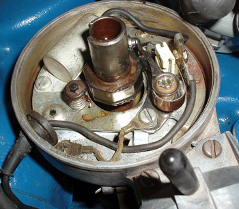 photo 3: the corrosion at the ground screw connecting the braided ground wire from distributor advance plate to the housing could have caused poor spark output.