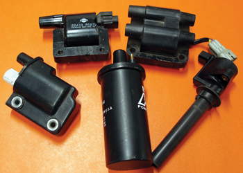 photo 1: most technicians are familiar with oil-filled (center), epoxy-filled (left), e-core, waste-spark and pencil-type (right) ignition coils. 