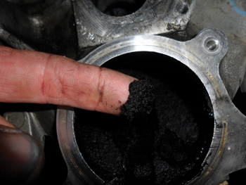 this is the soot that forms inside the intake when you incorporate an egr valve. simply remove the elbow from the intake manifold of your 6.0 and see for yourself.